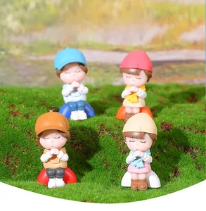 Set of four cute miniature girls figurines in colorful hats for garden decor