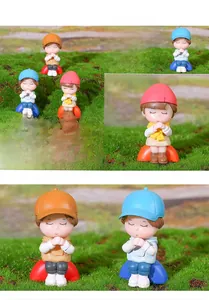 Macro detail of three cute PVC miniature figurines for succulent garden and cake decor