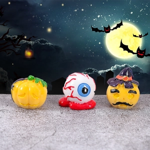 Three-piece Halloween miniature resin set featuring a pumpkin, spooky eyeball, and ghost wizard