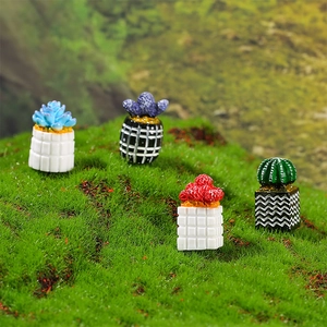 Set of four miniature dollhouse cactus succulents on grass for micro landscape decor