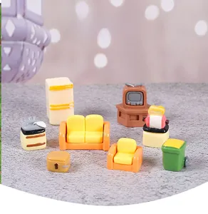 Detailed set of colorful miniature dollhouse furniture including yellow sofas and vintage TV