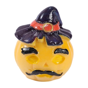 Halloween pumpkin figurine with wizard hat and mustache ornament on white background