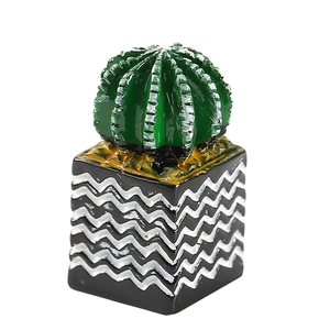 Miniature dollhouse cactus plant in green with a black and white striped square pot