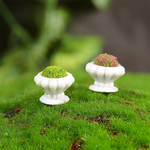 Miniature dollhouse plant pots set with green and red moss in white embossed planters