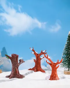 Macro detail of three artificial snow-covered miniature stumps for Christmas scenery