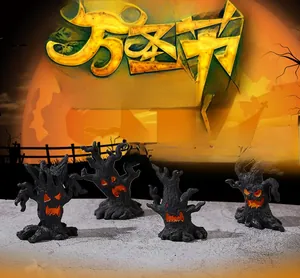Set of four spooky Halloween tree stump figurines with glowing orange faces and mystical moon