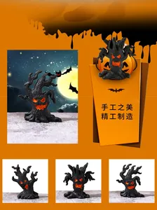 Macro view of four assorted resin Halloween tree monster figurines with glowing orange faces