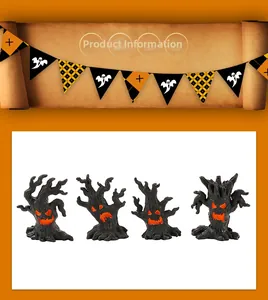 Set of four Halloween tree monster resin ornaments with glowing orange face details