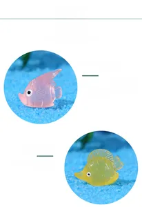 Macro detail of resin miniature fish figurines with vivid textures and translucent finish