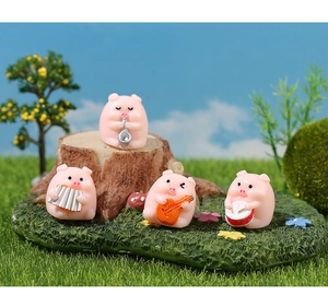 Miniature resin pigs playing saxophone, guitar, and drums in a fairy garden set