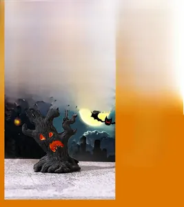 Close-up of resin Halloween tree monster with scary glowing face and wood texture