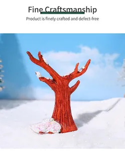 Detailed view of miniature resin snow tree with white frost and pink glitter snow base