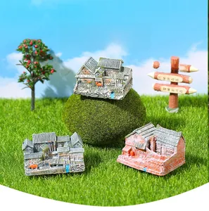 Detailed miniature Chinese courtyard house models on artificial grass landscape