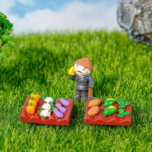 Miniature dollhouse farm set with farmer figurine and colorful vegetable baskets for garden decor