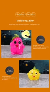 Detail of cute resin pumpkin and ghost figurines with expressive faces for Halloween