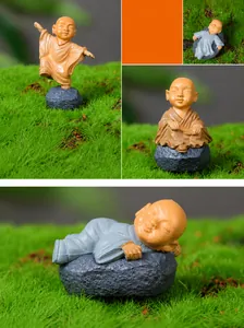 Detailed views of miniature monk figurines in various meditative poses for DIY terrariums