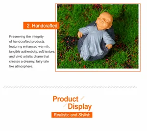 Detailed view of handcrafted miniature monk reclining on a realistic grey rock