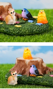 Detailweergave van harsdierfiguren met kat, vogel en hamster voor DIY-landschapsdecoratie