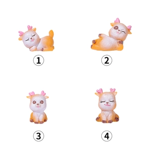 Set of four cute miniature resin deer figurines in diverse playful sitting and sleeping poses