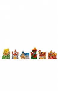 Detailed close-up of colorful resin fairy tale cottages and miniature castle ornaments