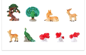 Detailed collection of resin miniature forest animals including peacocks, deer, and mushrooms