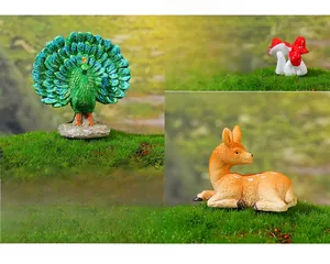 Miniature peacock and deer figurines with mushroom details for fairy garden scenery