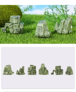 Detailed macro view of 6-piece miniature resin rockery stones with moss and relief texture