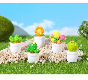 Set of five miniature dollhouse plants including cactus and tulips in white pots