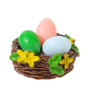 Miniature Easter resin nest with colorful eggs and yellow flowers for micro landscape
