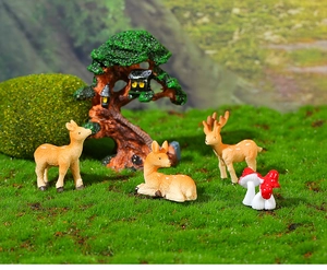 Miniature resin deer and mushroom set for fairy garden decoration on mossy surface