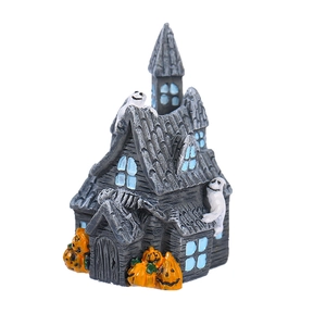 Miniature resin Halloween haunted house with white ghosts and orange pumpkins decoration