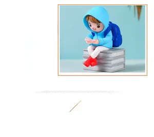 Detailed view of cartoon girl in blue raincoat sitting on books holding a game console