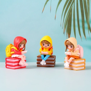 Three creative cartoon girls on books PVC figurines for home or office desk decor
