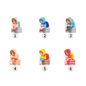 Set of six creative PVC cartoon figures sitting on books for cute home and desktop decor