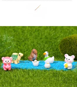 Miniature resin animals like turtles and birds on moss landscape for terrarium decor