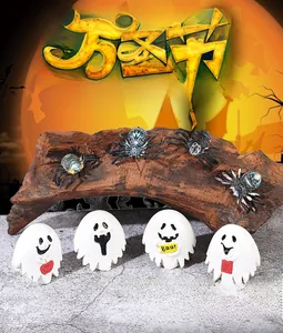 Miniature Halloween decor set with four spooky white ghosts and realistic black spiders