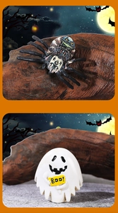 Miniature Halloween decor with black spider and ghost holding a Boo sign