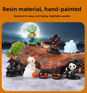 Detail of hand-painted Halloween resin miniatures including ghosts and pumpkins