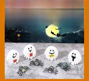 Macro detail of Halloween ghost figurines and decorative spiders for micro landscapes