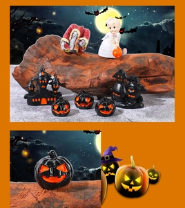 Macro view of Halloween resin miniature set featuring black pumpkin and spooky castle