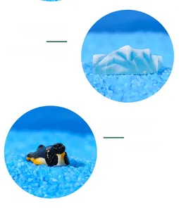 Macro detail of resin polar iceberg and miniature penguin figurine for micro landscapes