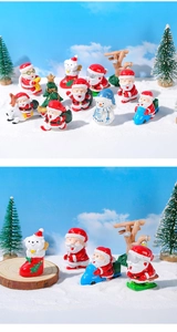 Dettaglio di figurine natalizie in resina con Babbo Natale e pupazzo di neve