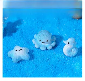 Macro shot of resin starfish, seahorse and octopus miniature set with glitter finish