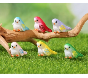 Detailed macro view of six colorful resin birds for succulent garden landscape decor