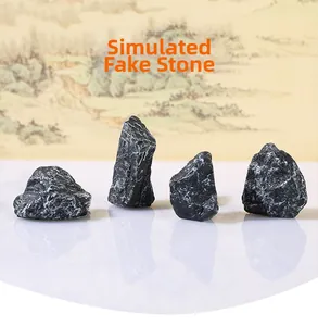 Set of four realistic black micro landscape rocks with grey veins for zen garden decor
