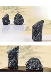 Detailed macro view of artificial black rock ornament with realistic white texture and veins