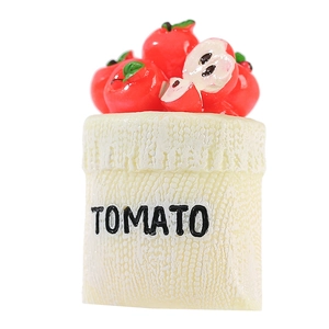 Miniature resin tomato basket model with detailed red tomatoes and white textile bag