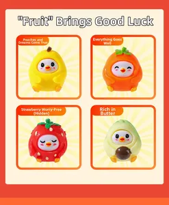 Close-up of resin fruit figurines including pear, persimmon, strawberry and avocado