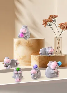 Detailed view of six mini resin hippo figurines in various playful poses for home decor