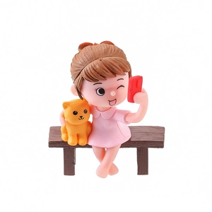 Cute resin girl selfie figurine with orange cat on bench for tabletop decor
